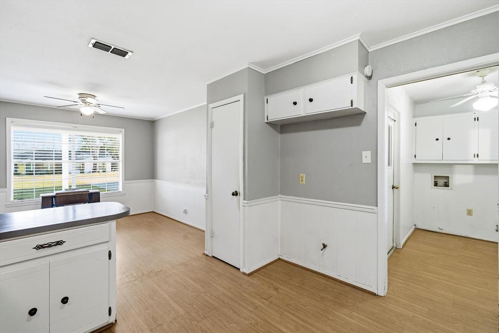 216 Helen Drive Lindale, TX 75771 - Photo 9 of 39 a view of kitchen with wooden floor and window