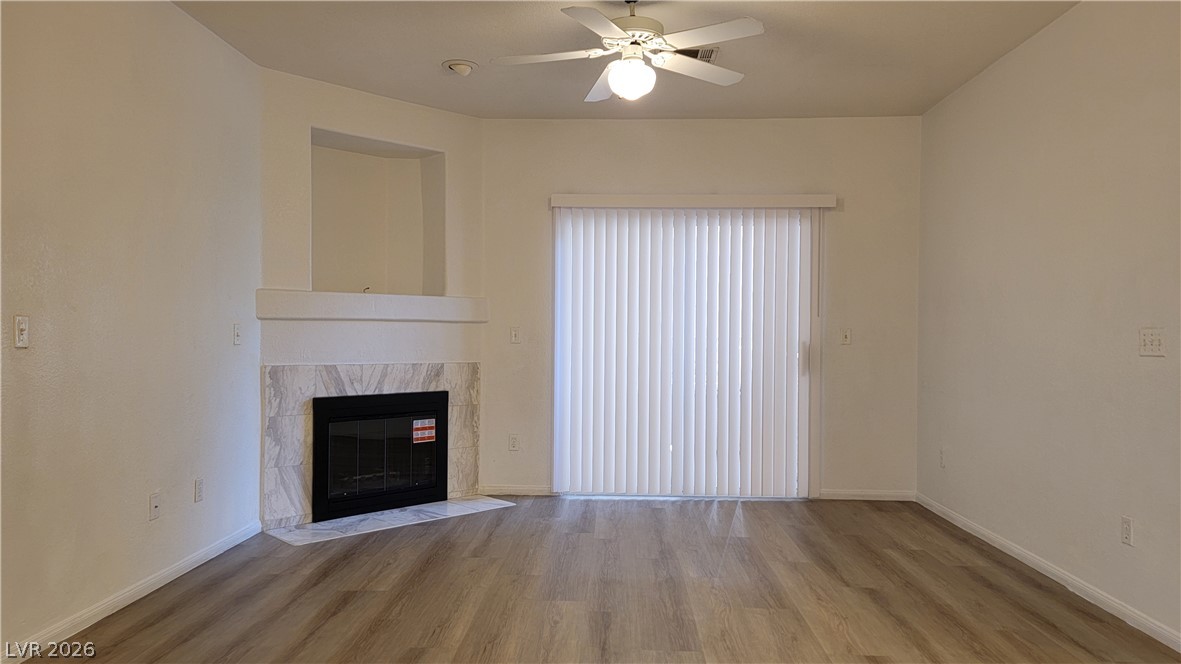 A pristine living area awaits with a fireplace, ready for cozy evenings.