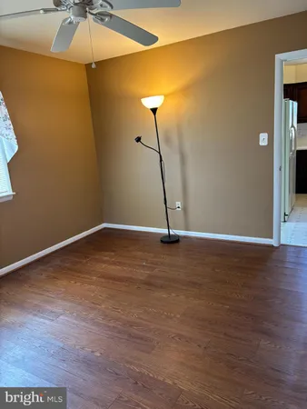 a view of a room with wooden floor