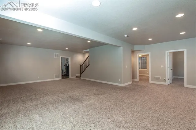 a view of a livingroom with an empty space and window