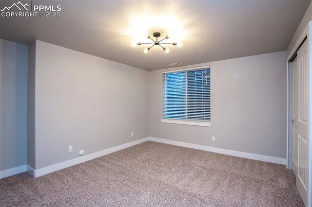 a bathroom with a granite countertop sink a shower and a mirror