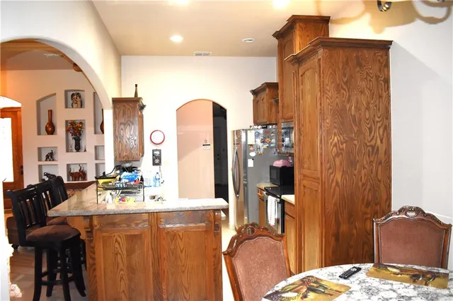 a bedroom with bed and furniture