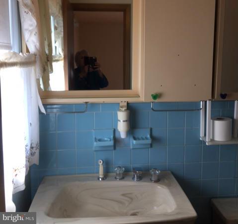 2009 Cherry Road Edgewood, MD 21040 - Photo 19 of 30 a bathroom with a sink and a mirror