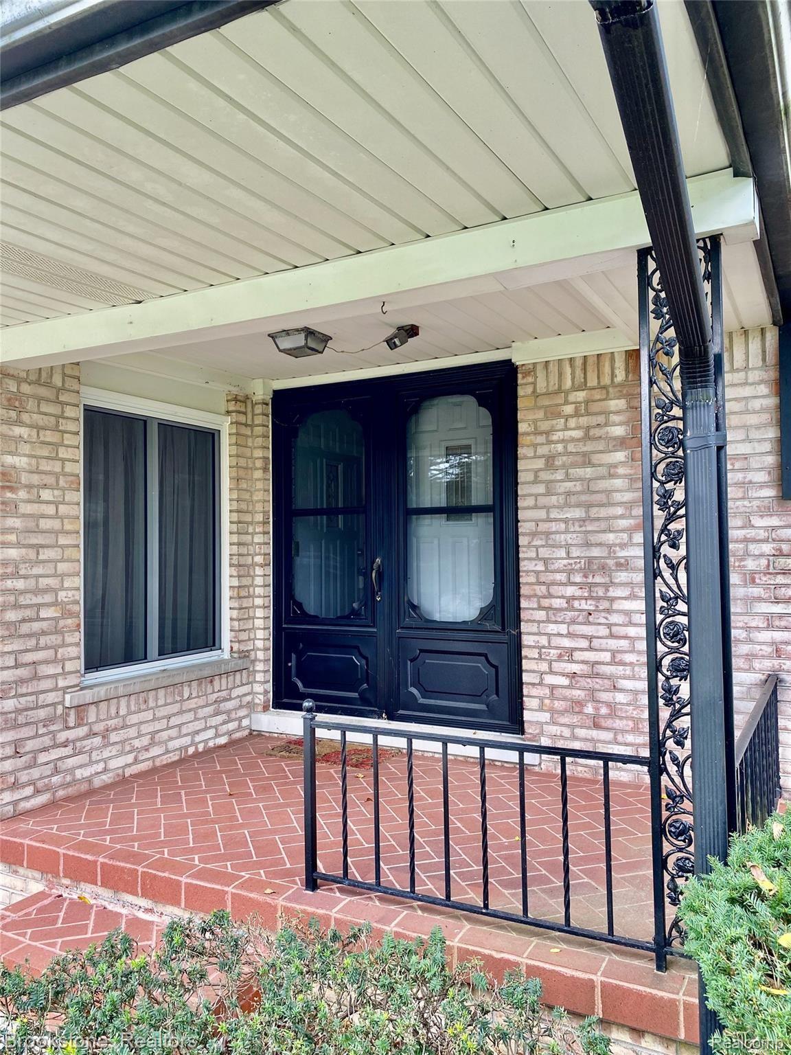 838 Wilwood Road Rochester, MI 48309 - Photo 18 of 53 THE FRONT DOUBLE DOORS LEAD TO A FOYER WITH A SLATE & WOOD FLOOR. CHECK OUT THE LOW MAINTENANCE EXTERIOR!
