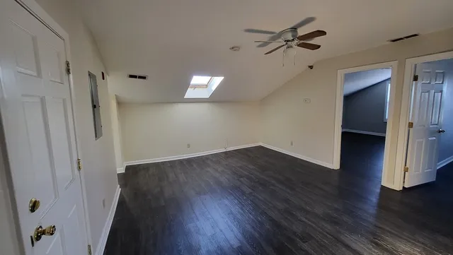 a view of a livingroom with wooden floor