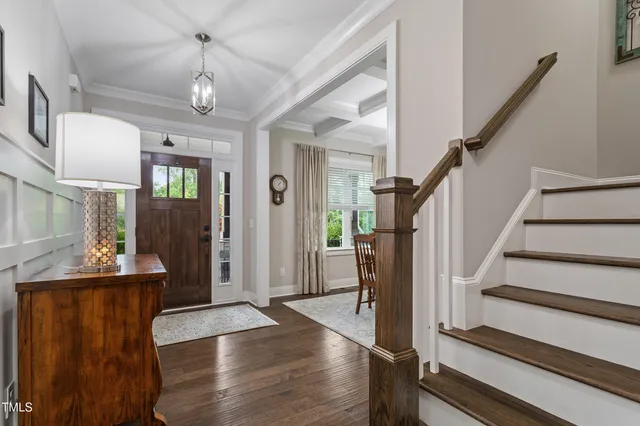 a view of entryway and hall with wooden floor