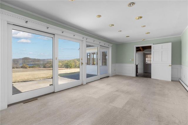 a view of a room that has a large window