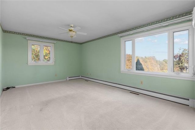 a bathroom with a shower sink vanity and mirror
