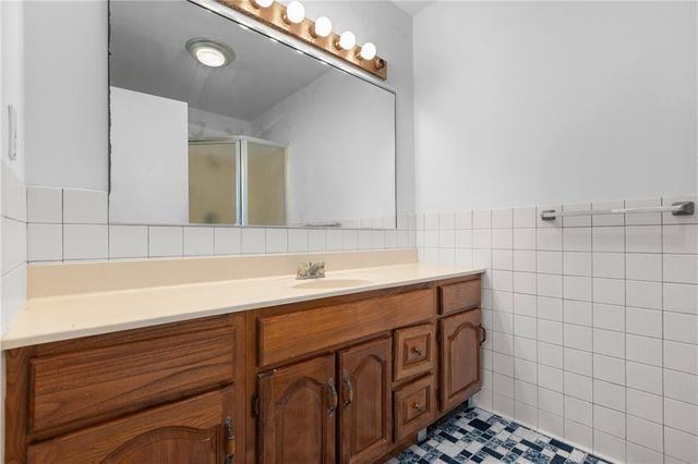 a view of a living room and kitchen
