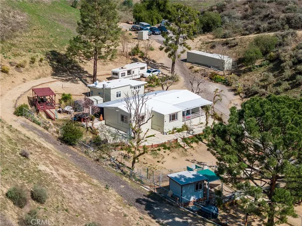 an aerial view of a houses with yard