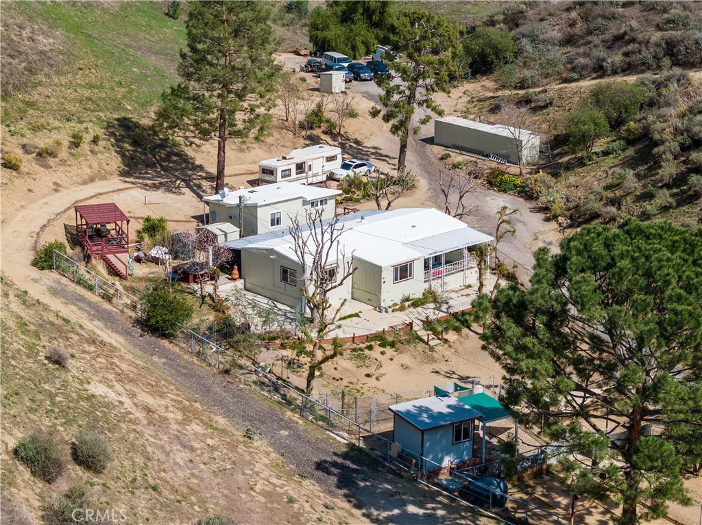 an aerial view of a houses with yard