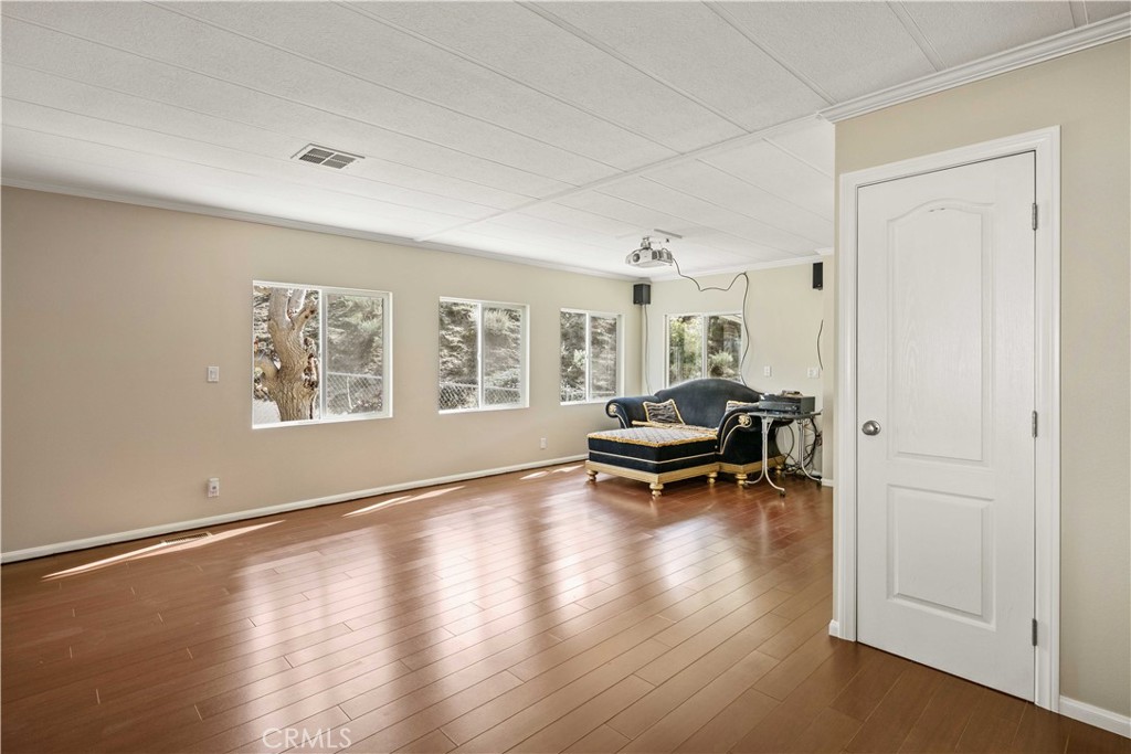 28274 San Martinez Grande Canyon Road Castaic, CA 91384 - Photo 14 of 48 a view of livingroom with hardwood floor and a window