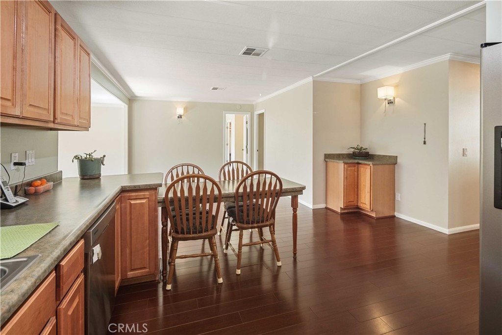 28274 San Martinez Grande Canyon Road Castaic, CA 91384 - Photo 15 of 48 a view of a a dining room with furniture window and wooden floor