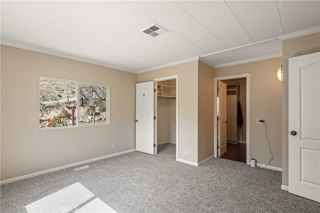 28274 San Martinez Grande Canyon Road Castaic, CA 91384 - Photo 21 of 48 a view of an empty room with closet and a window