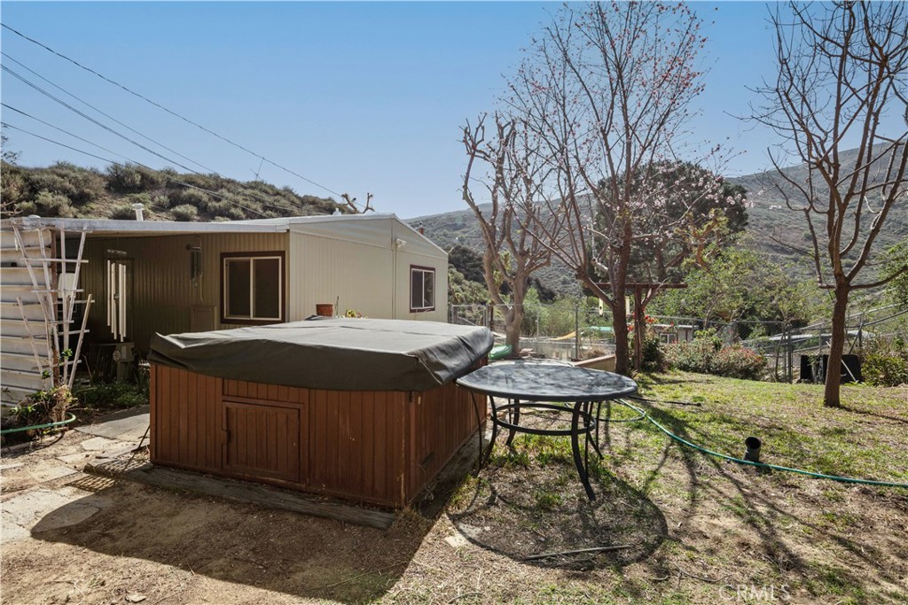 28274 San Martinez Grande Canyon Road Castaic, CA 91384 - Photo 41 of 48 a view of a house with backyard and sitting area
