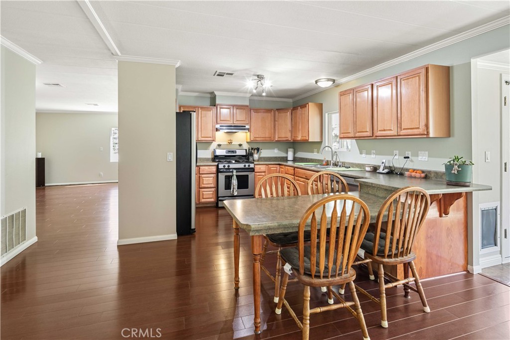 28274 San Martinez Grande Canyon Road Castaic, CA 91384 - Photo 9 of 48 a view of a dining room with furniture window and wooden floor