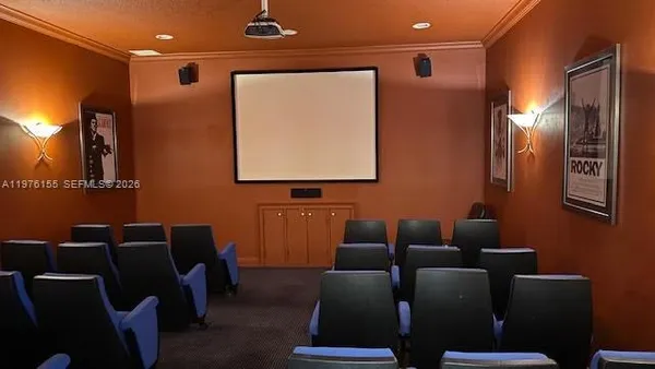 a media room with lots of chairs and a projector screen