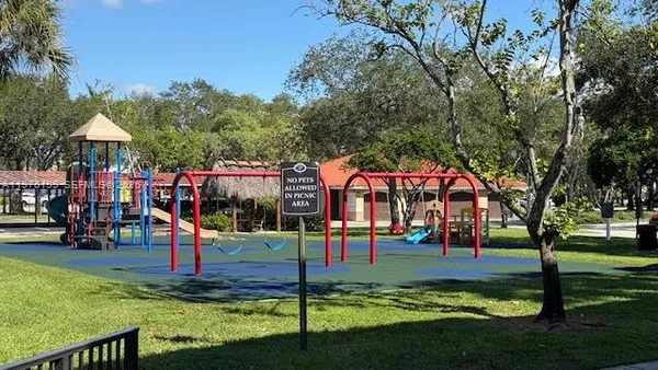 a view of a park with swings