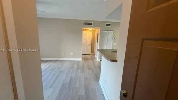a view of a room that has a window in it
