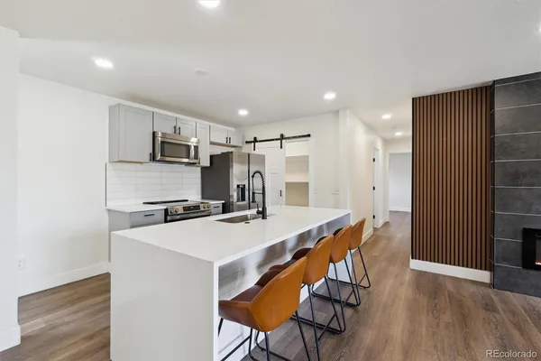a bathroom with a toilet sink a shower and mirror