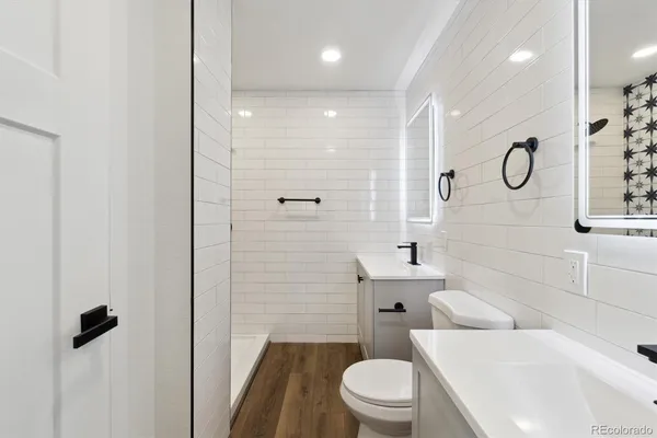 a bathroom with a bathtub and shower