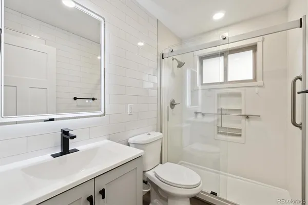 a room with wooden floor and window