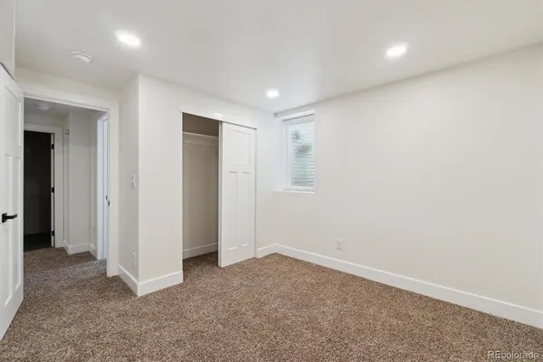 a view of a yard with large trees