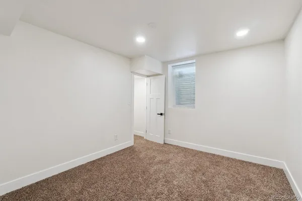 a view of a yard with a large tree