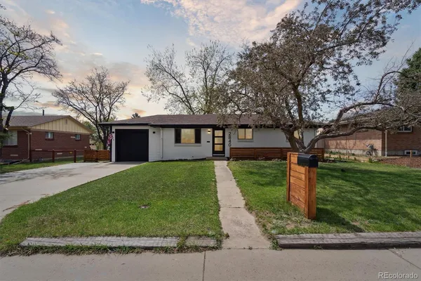 a front view of a house with yard