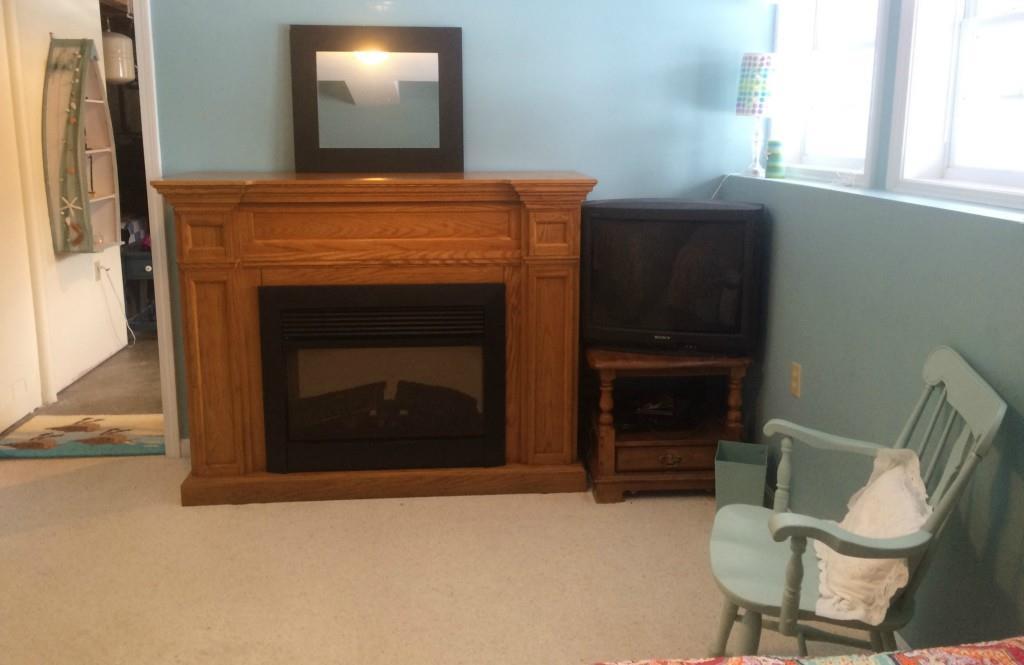 85 Lakeview Road West Boothbay Harbor, ME 04575 - Photo 18 of 24 The electric fireplace in the lower...