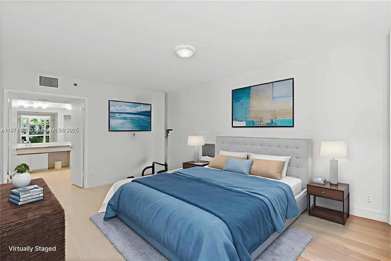 3600 Mystic Pointe Drive, Unit 215 Aventura, FL 33180 - Photo 12 of 49 a bedroom with a bed and wooden floor