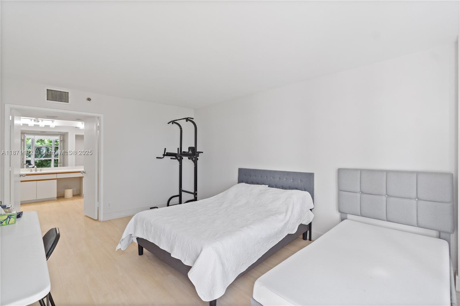 3600 Mystic Pointe Drive, Unit 215 Aventura, FL 33180 - Photo 13 of 49 a bedroom with a bed and window