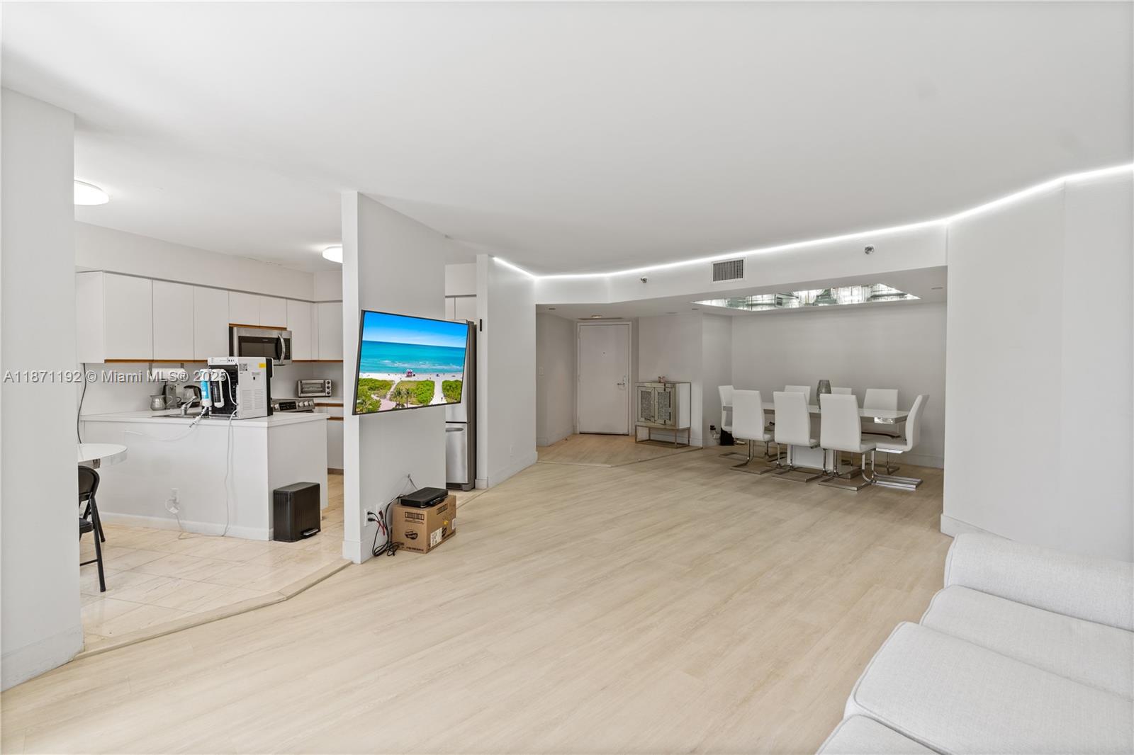 3600 Mystic Pointe Drive, Unit 215 Aventura, FL 33180 - Photo 7 of 49 a room with a chair and gym equipment