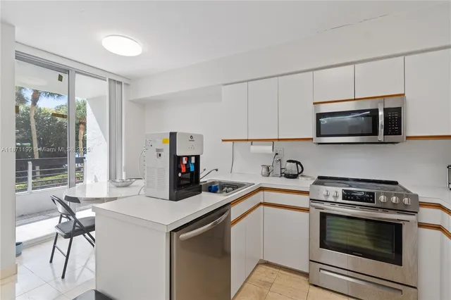 a kitchen with a stove and a microwave