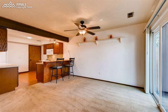 4737 Barnes Road Colorado Springs, CO 80917 - Photo 4 of 11 Dining area with walk out to patio