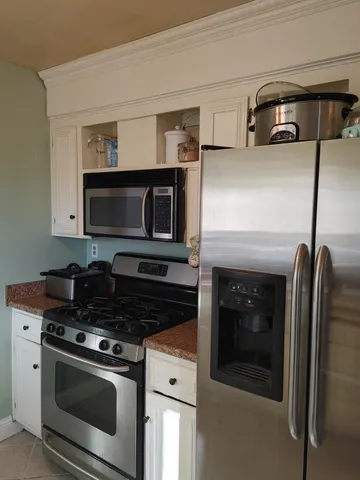 a kitchen with a stove and a microwave