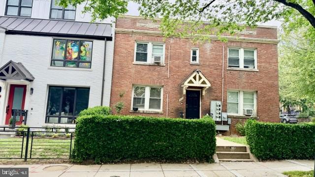 1424 Staples Street Northeast, Unit 1 Washington, DC 20002 - Photo 1 of 8 a front view of a house with garden