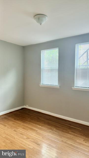 1424 Staples Street Northeast, Unit 1 Washington, DC 20002 - Photo 5 of 8 a view of a room with wooden floor and window