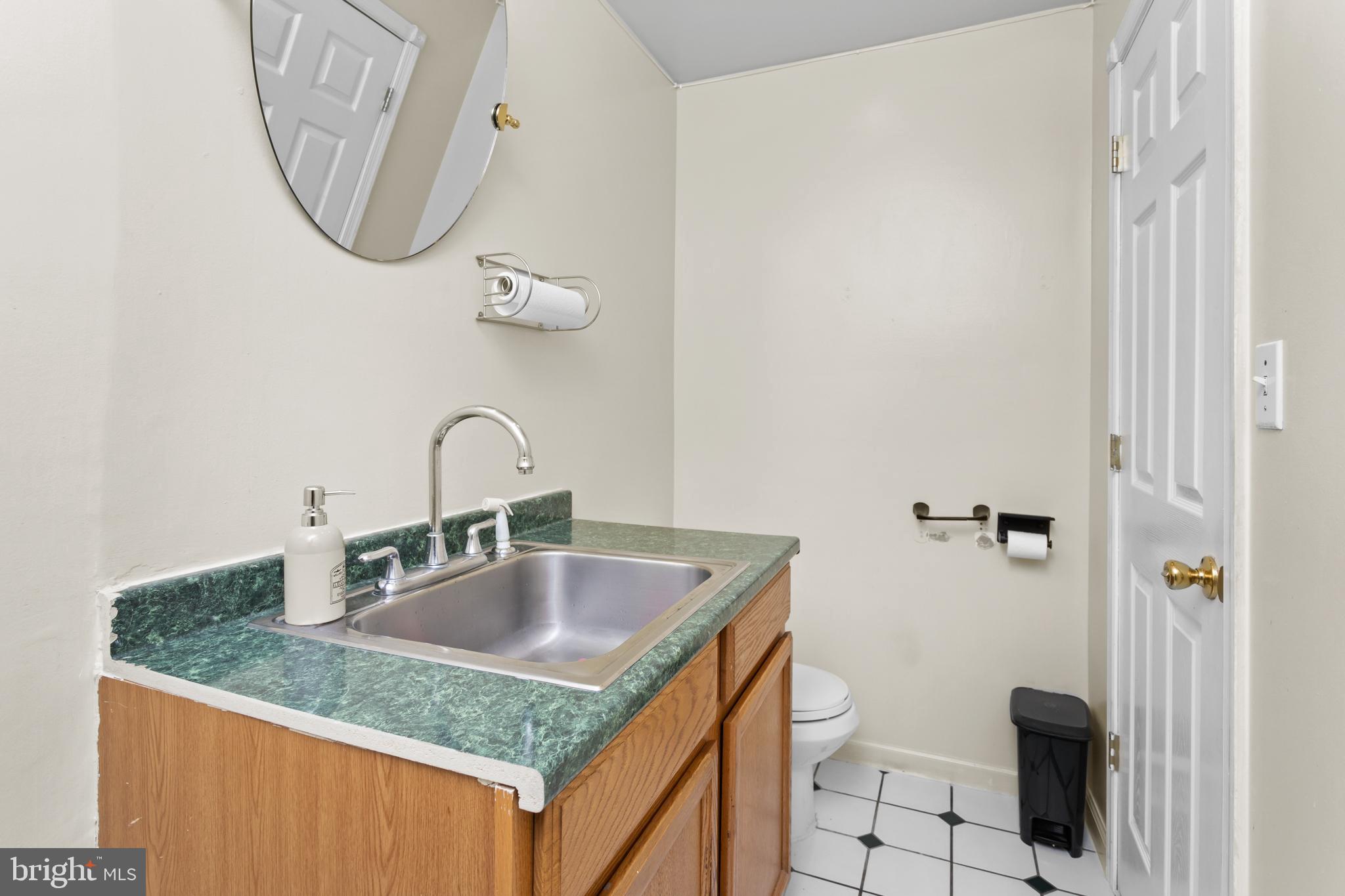 59 Bordentown Chesterfield Road Chesterfield, NJ 08515 - Photo 16 of 50 a bathroom with a granite countertop sink a toilet and a mirror