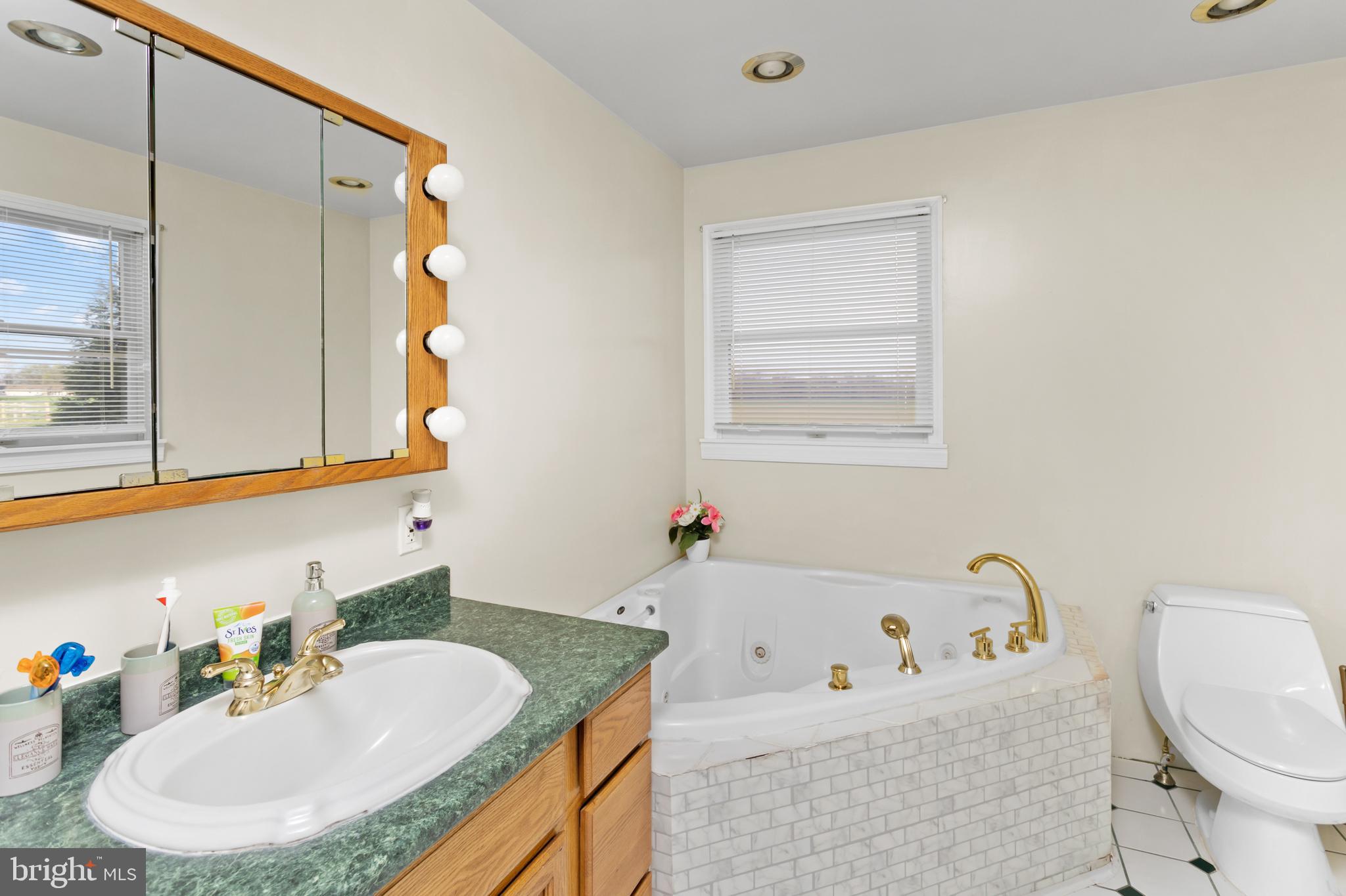 59 Bordentown Chesterfield Road Chesterfield, NJ 08515 - Photo 20 of 50 a bathroom with a tub sink and mirror