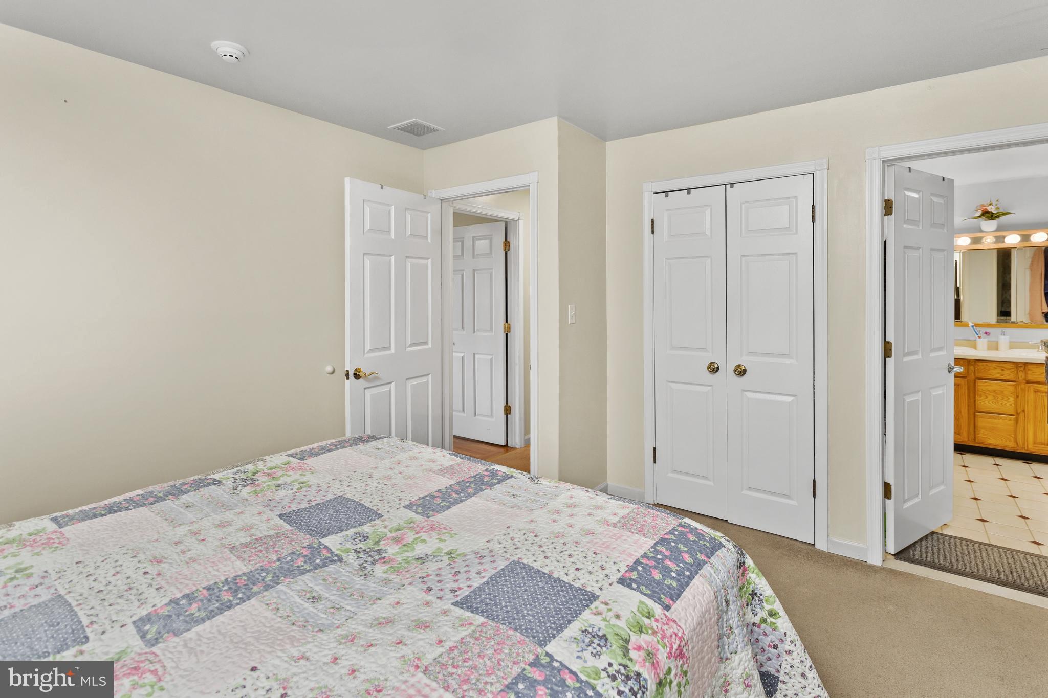 59 Bordentown Chesterfield Road Chesterfield, NJ 08515 - Photo 26 of 50 a bedroom with a bed and a flat screen tv