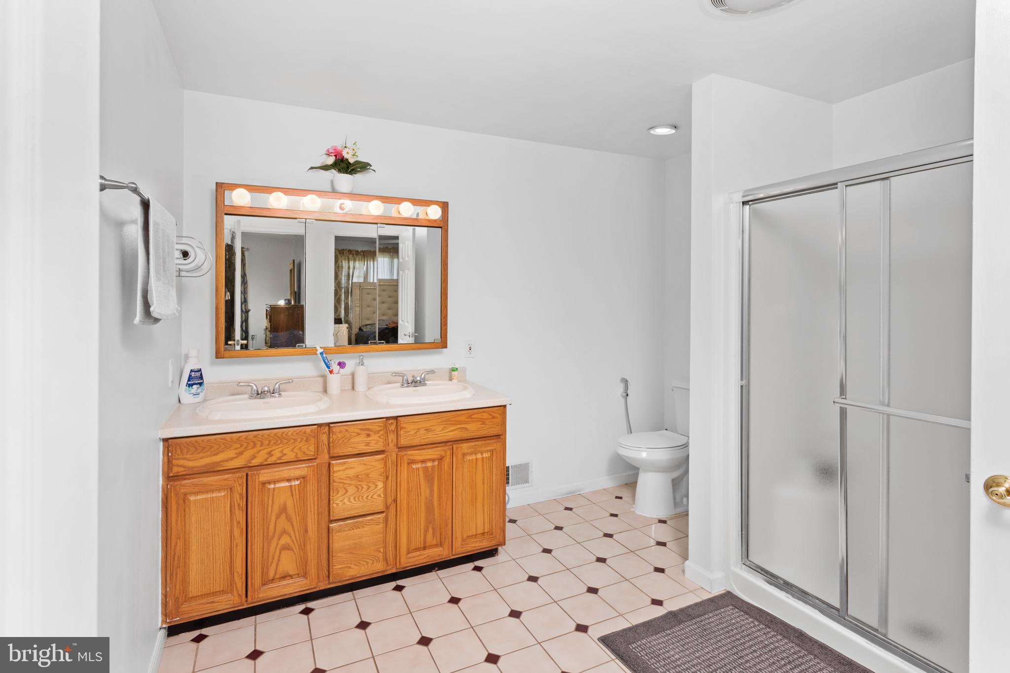 59 Bordentown Chesterfield Road Chesterfield, NJ 08515 - Photo 27 of 50 a bathroom with a sink a toilet and a mirror