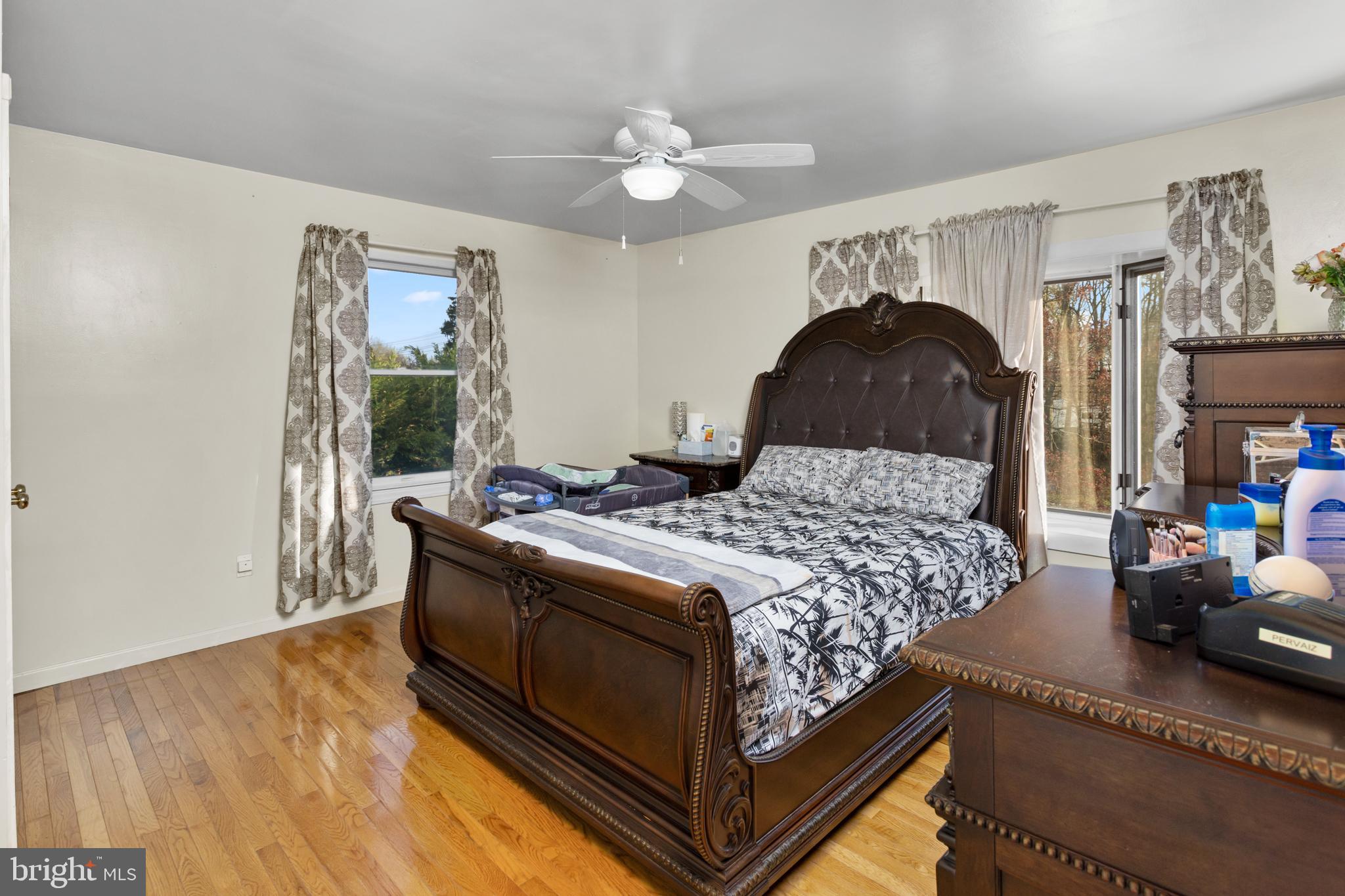 59 Bordentown Chesterfield Road Chesterfield, NJ 08515 - Photo 30 of 50 a bedroom with a bed and a chandelier