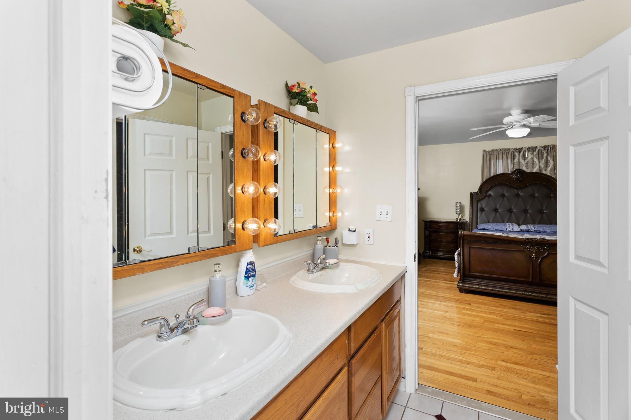 59 Bordentown Chesterfield Road Chesterfield, NJ 08515 - Photo 32 of 50 a en suite bathroom with a sink and a mirror
