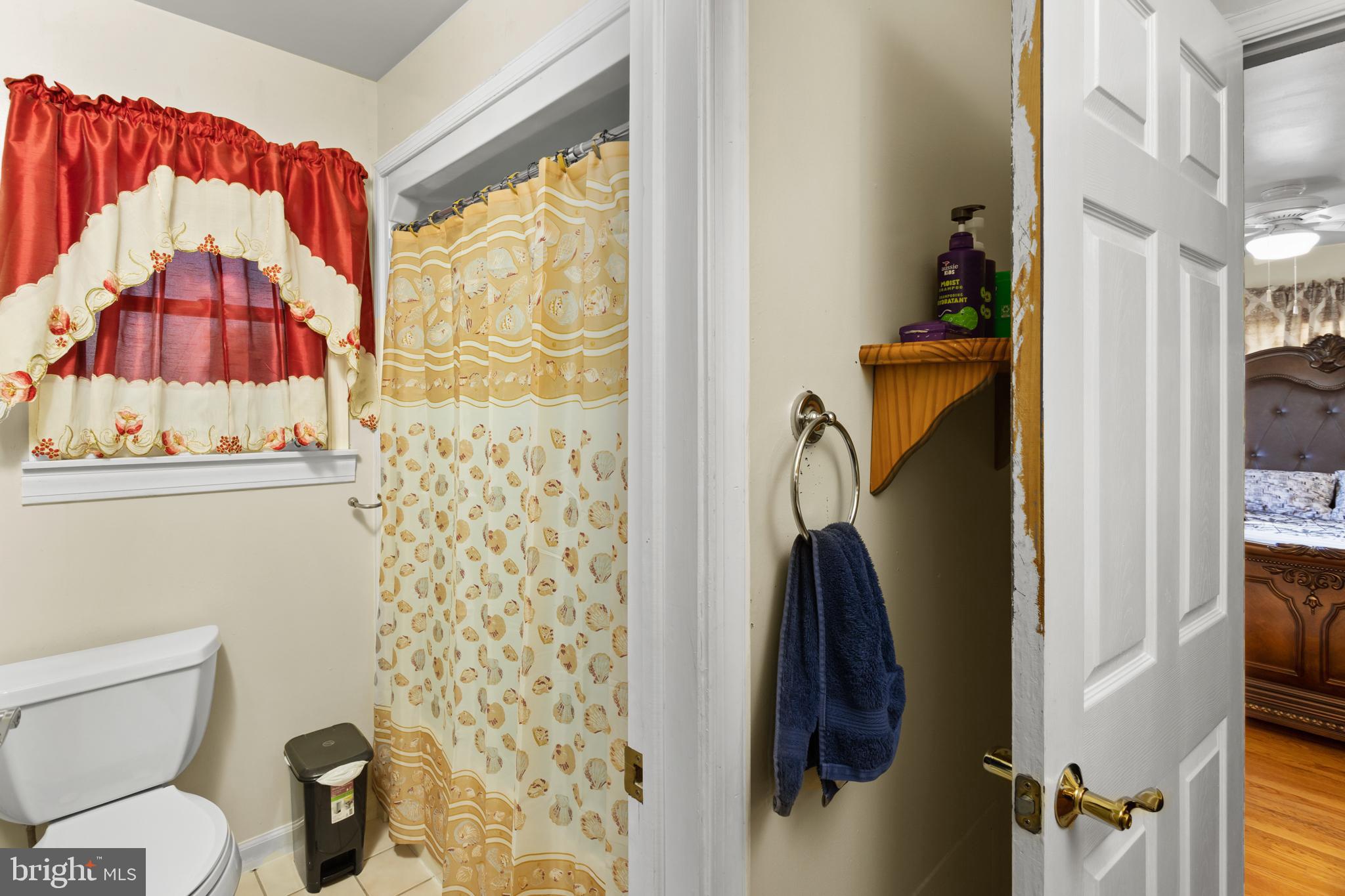 59 Bordentown Chesterfield Road Chesterfield, NJ 08515 - Photo 33 of 50 a bathroom with a toilet and a shower curtain