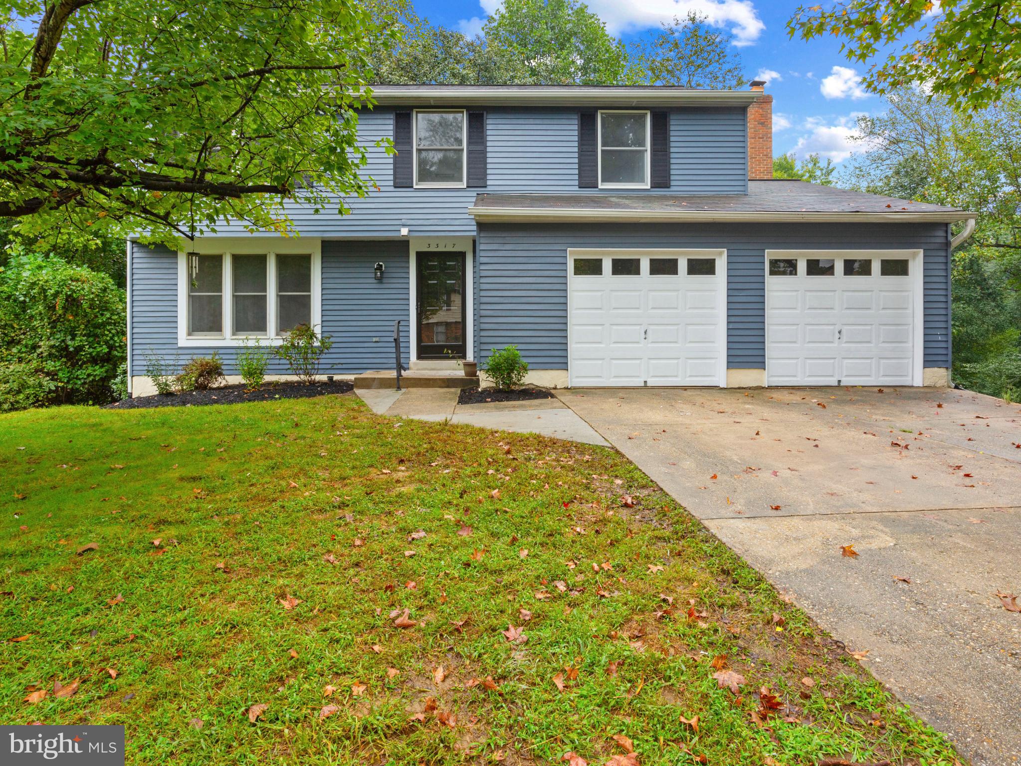 front view of a house with a yard
