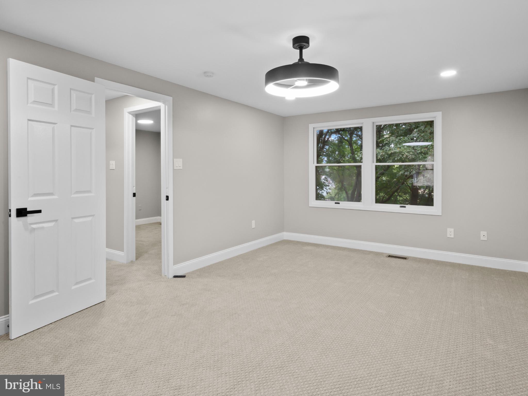3317 Grayvine Lane Bowie, MD 20721 - Photo 15 of 36 a view of an empty room with a window and wooden floor