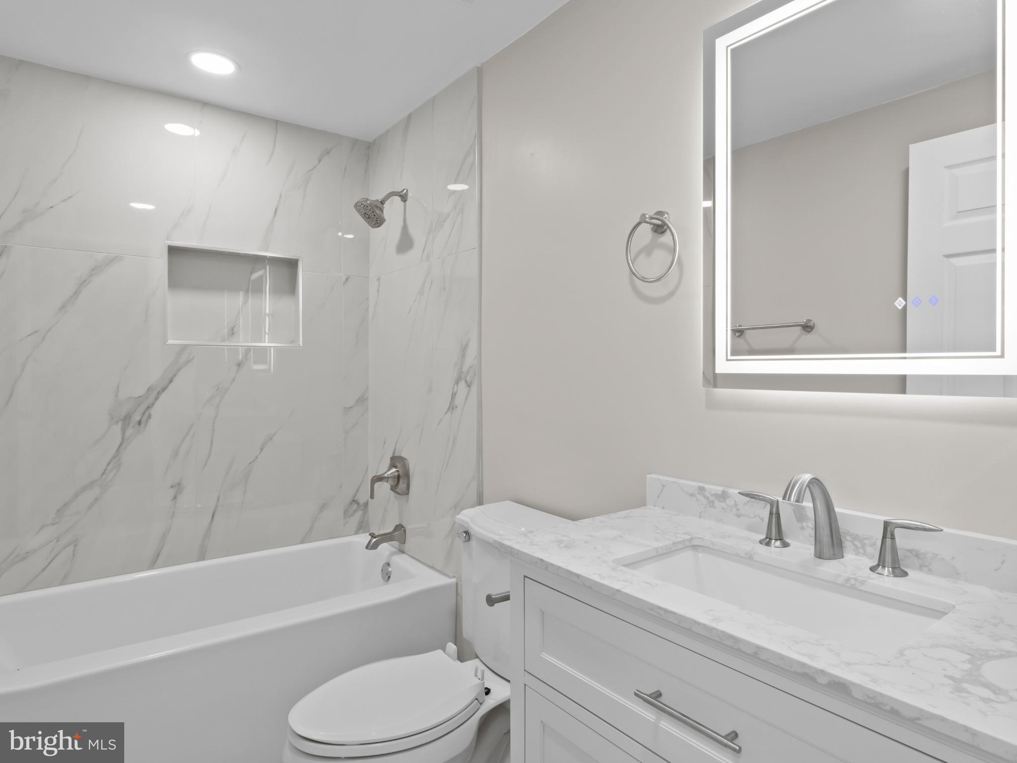 3317 Grayvine Lane Bowie, MD 20721 - Photo 20 of 36 a bathroom with a granite countertop sink toilet tub and shower