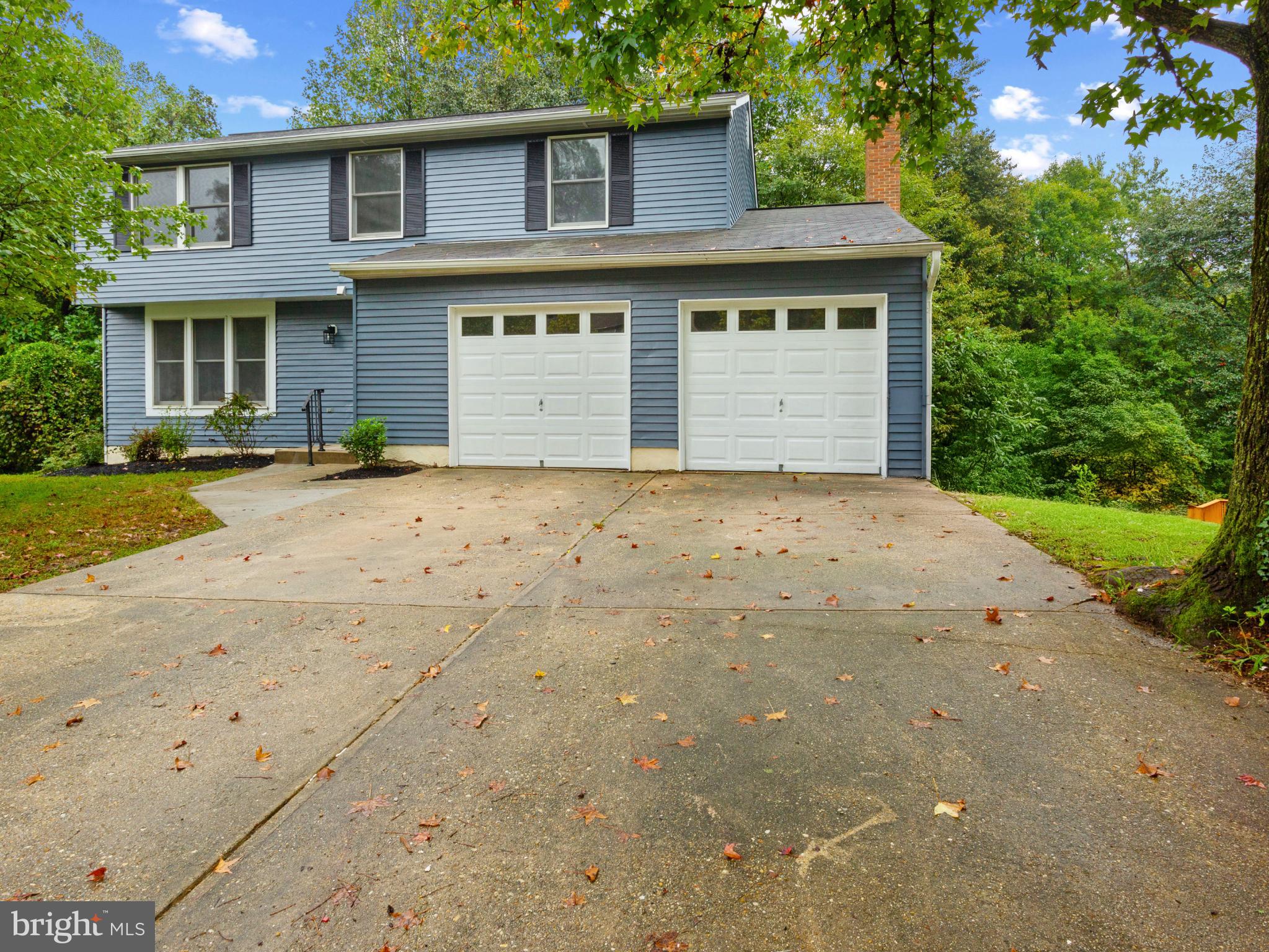 3317 Grayvine Lane Bowie, MD 20721 - Photo 2 of 36 a front view of a house with a garden