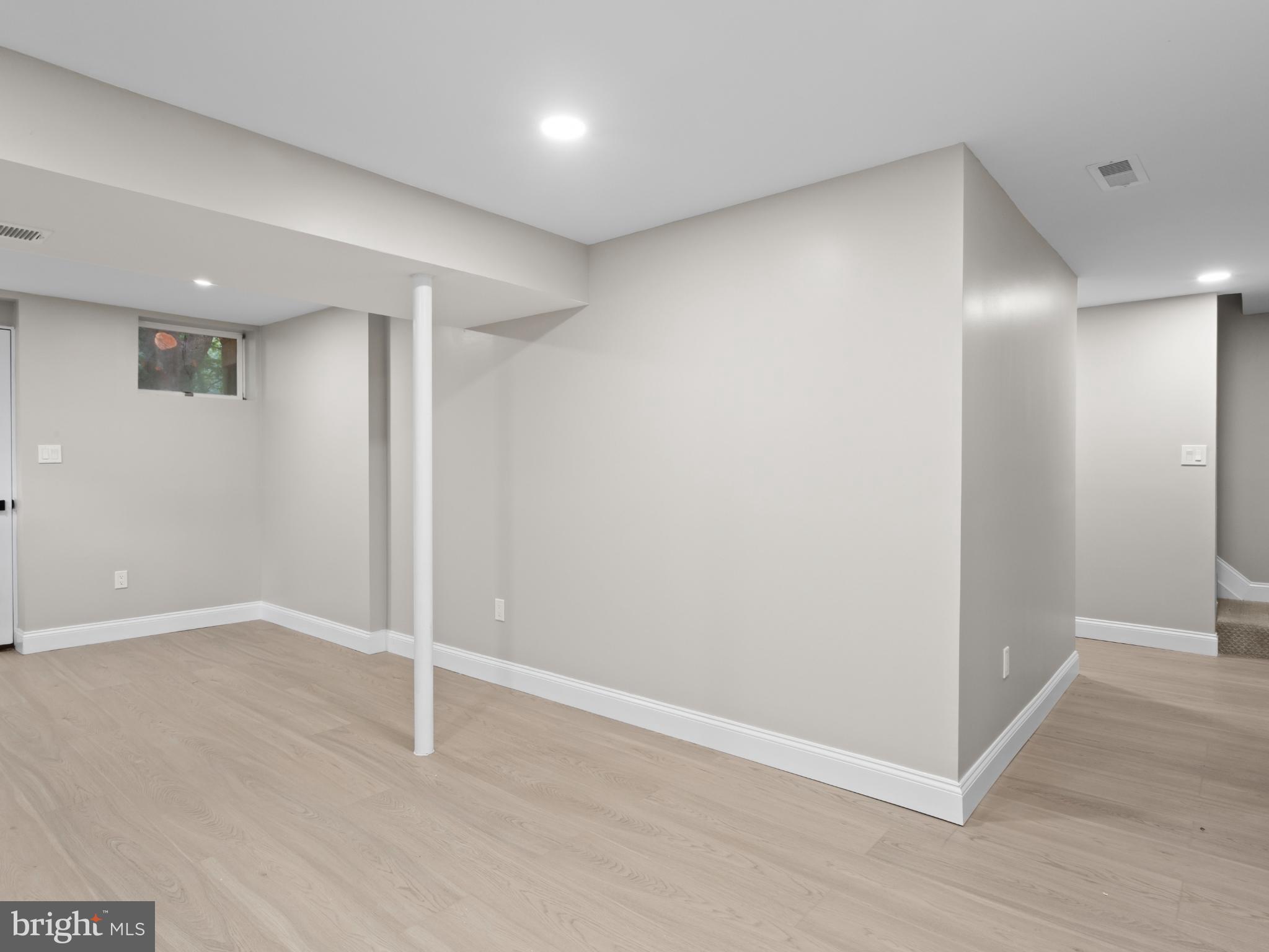 3317 Grayvine Lane Bowie, MD 20721 - Photo 25 of 36 an empty room with wooden floor